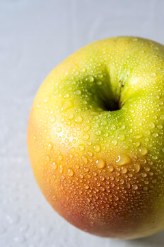 Apple with water drops, close up 