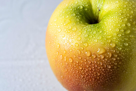 Apple with water drops, close up 
