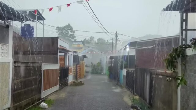 Torrential rain in a village.
