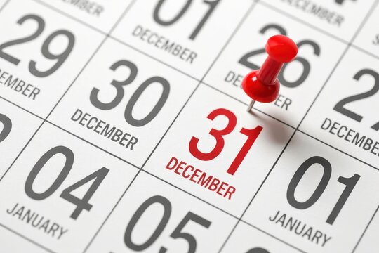 Red push pin on december 31st calendar date