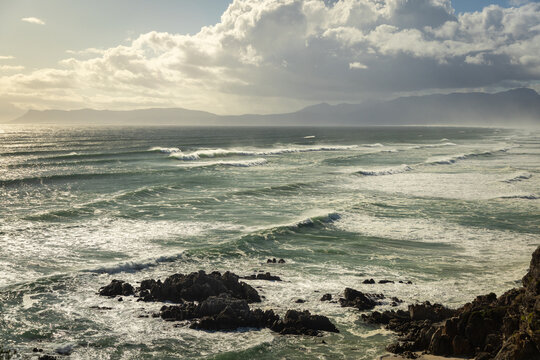 aerial view of massive wave sets rolling into Walker Bay Nature Reserve, South Africa 