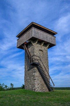 Steep wooden staircase climbing the Vartovka watchtower above Krupina, Slovakia