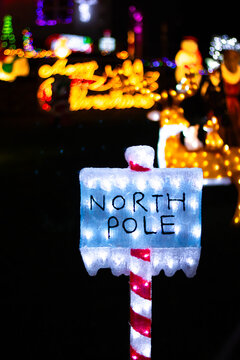 Christmas neon light figure with the inscription North Pole, vertical shot