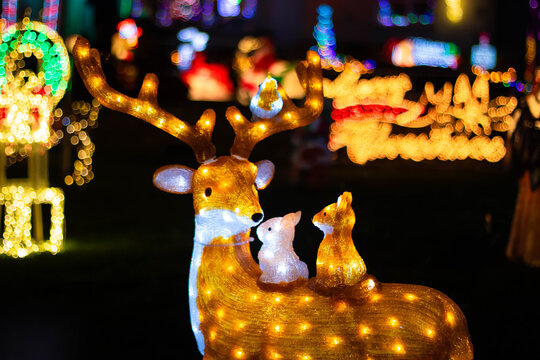 Deer with a fox and a hare on his back, Christmas figurine with illuminations