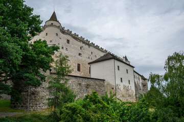 Corner turret and stone curtain wall of Zvolen Castle seen from the wooded slope below, Zvolen, Slovakia © Michal Plevko
