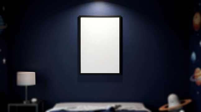 Vertical blank poster frame mockup on a dark blue wall with spotlight in a modern bedroom interior with space themed planets wallpaper and dramatic night lighting for home decor presentation.