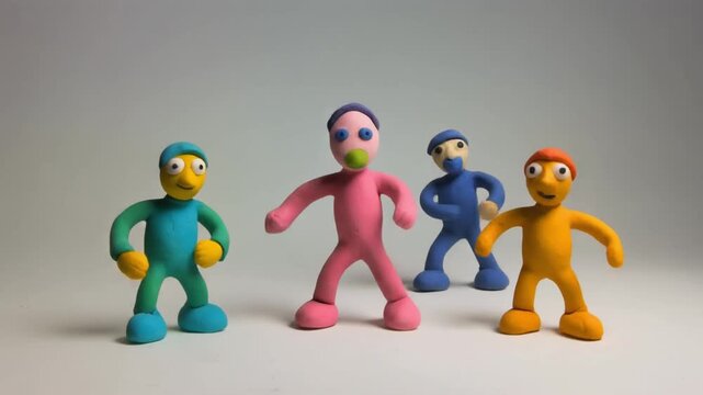 Group of handmade plasticine figures standing together on white surface creative stop motion animation clay modeling craft art
