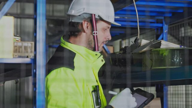 Industrial Worker Safety Helmet Fluorescent Jacket Inspecting Machinery in Warehouse Workplace Logistics Factory Equipment Protective Glass Tablet Gloves Focused Manufacturing Operations