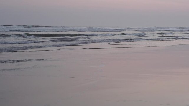 Serene Sunset at Parangtritis Beach, Yogyakarta - Gentle Waves Lapping on Sandy Shoreline