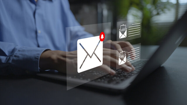 Email marketing and online communication concept. Person using laptop with envelope message, global connection network and target audience icons, digital outreach campaign.