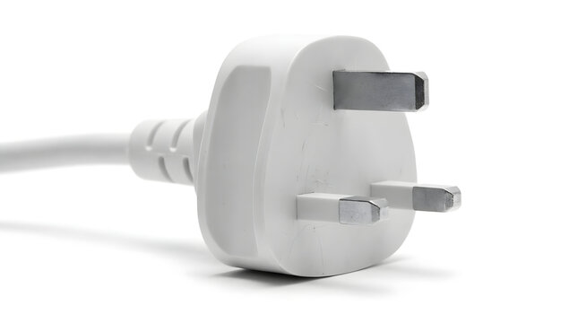 A close-up of a white three-pin British power plug connector isolated on a clean white background for electricity.