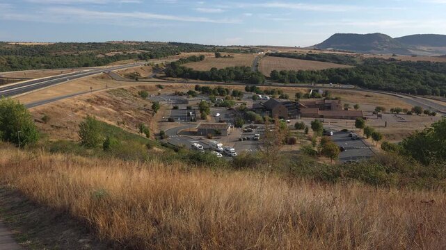 Millau Scenic Overlook in Nature. A breathtaking view of vast fields and distant mountains. Explore the beauty of rural landscapes and serene surroundings effortlessly.