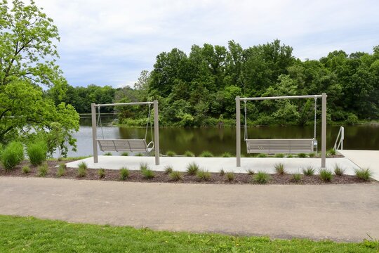 The empty bench at the lake in the park.