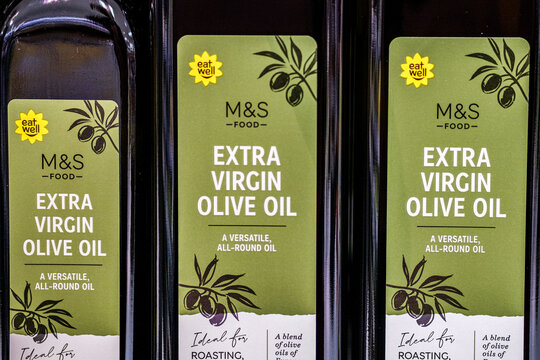 Close-Up Of A Row Of Marks And Spencer Eat Well Extra Virgin Olive Oil Bottles