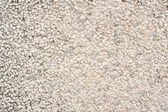 Detailed pebble texture backdrop featuring natural stone surface for architectural design projects