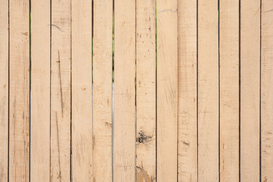 Natural light wood fence texture for background design featuring vertical planks with rustic finish