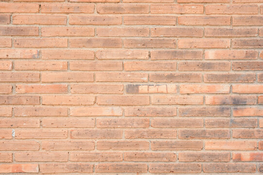 Brown brick wall texture for rustic architectural background and industrial interior design projects