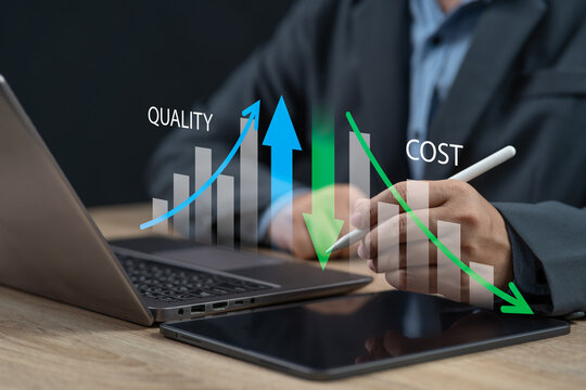 Businessman pointing at a graph showing cost reduction and quality improvement, Managing business performance, Controlling expenses efficiently, Increasing profit through effective quality management