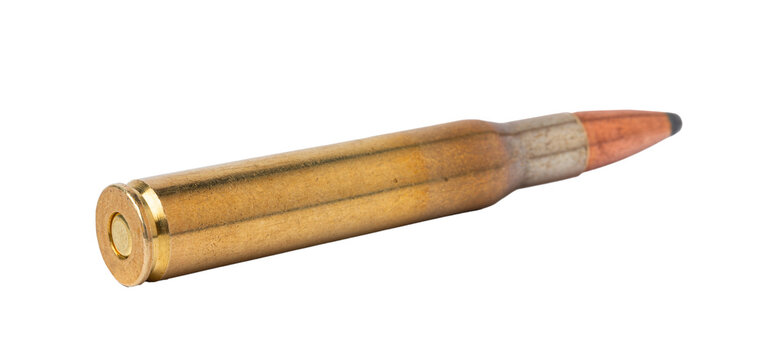 Close-up of a bullet resting on a flat surface showcasing its details and structure