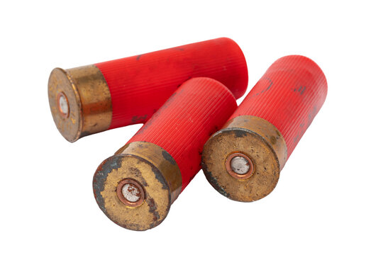 Three red shotgun shells are arranged on a plain white background