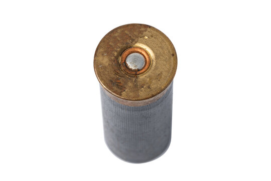 Old shotgun shell viewed from above showing metal and plastic parts
