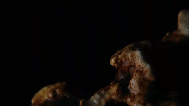 Rain drops on dark brown stone surface negative space BMA Visuals Horizontal Video