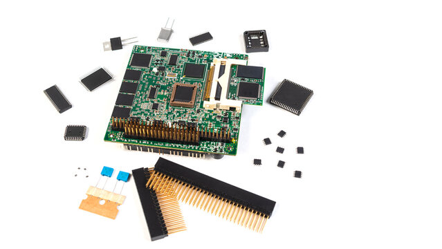 Circuit board and electronic components arranged on a white surface during a technology project