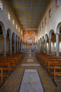 Interior view of the central nave with ancient columns, ciborium, and apse fresco at Church of San Giorgio in Velabro, Rome, Italy