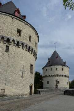 The iconic Broel Towers (Broeltorens) in Kortrijk, West Flanders, Belgium. The medieval towers span the River Lys in the city centre. Copy space above.