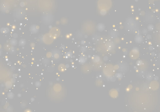 Scattered glowing particles create a dynamic bokeh effect across a dark background. Soft, diffused orbs of orange and white vary in size and intensity.