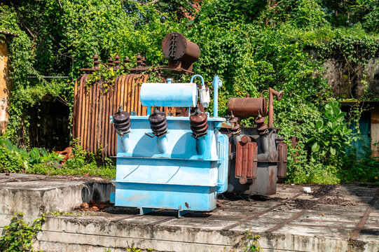 Power supply in India is a critical driver of socio-economic growth, supporting industrial competitiveness. Abandoned transformers were seen alongside the power grid at a power house. Power sector.