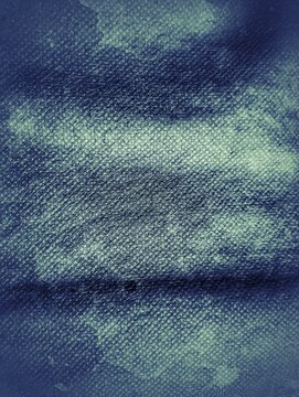 Close-up texture of dark blue non-woven fabric from goody bag, textured background added with grunge effect