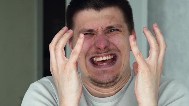An angry man is shouting and expressing dissatisfaction.
Display of negative emotions.