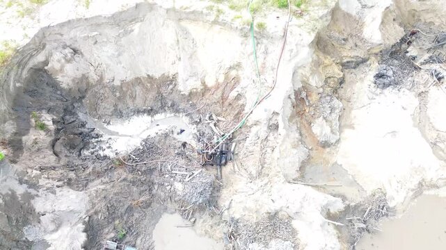 Traditional Tin Mining Operations Featuring Diesel Water Pump