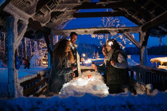 New Year celebration with friends in mountain cabin.