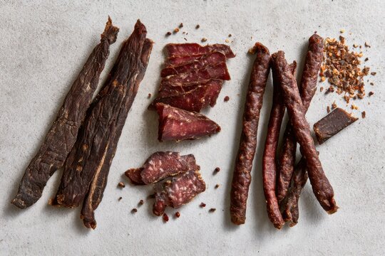 South African Biltong and Dry Wors Flat Lay on Grey Background