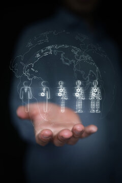 Hand holding globe with human to robot evolution. Global artificial intelligence disruption, worldwide workforce automation, AI digital labor transformation, and industrial future. Vertical photo.