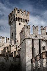 Ancient white stone castle with rectangular towers on sunny day, Sirmione, Lake Garda, Italy © Igor