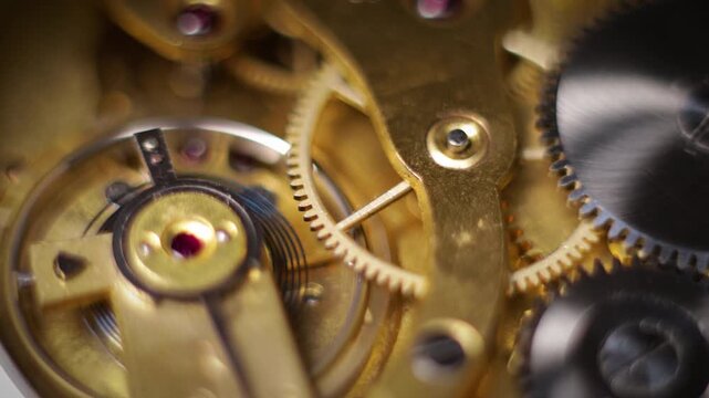 Macro closeup of the intricate brass gears and mechanical movement inside a vintage mechanical watch