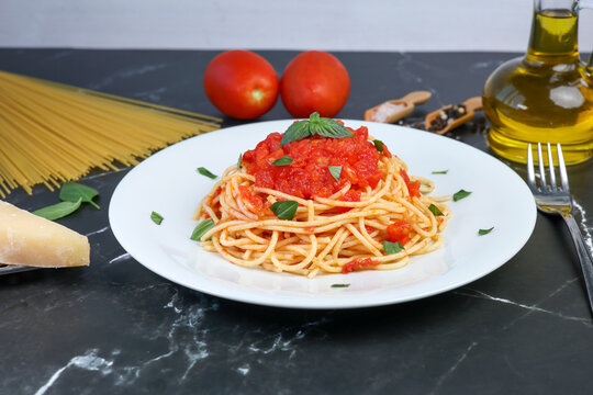 spaghetti pasta with tomato sauce and basil