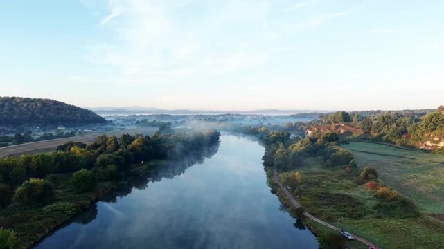 Aerial Drone View of Benedictine Abbey and River Covered in Morning Fog, Poland