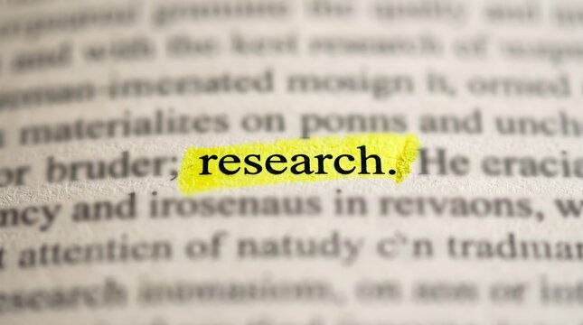 Highlighted word research on printed academic document with yellow marker