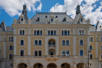 Neo gothic facade of Drechsler Palace with steep slate roof and pointed turrets beside the Budapest Opera House © Guillaume Angleraud