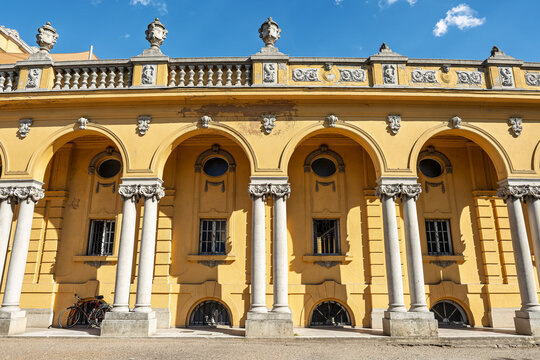 Arcaded courtyard wing of the Sz&eacute;chenyi baths with round oculus windows and sculpted urns in Budapest, Hungary
