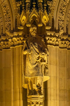 Bearded statue of Saint Stephen with a crown and crozier adorns the Hungarian Parliament facade in Budapest