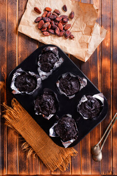 Chocolate chip muffins mini size on a board, double chocolate muffins,