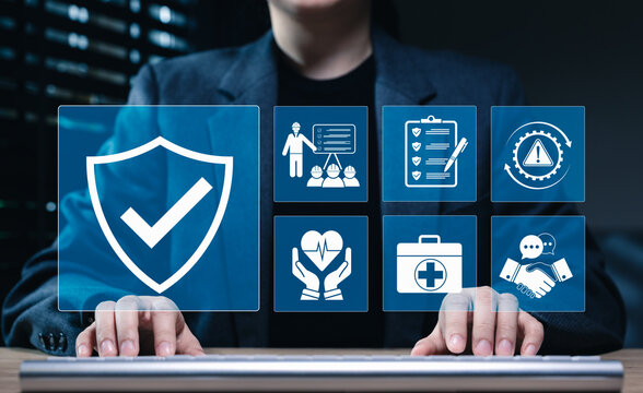 Work safety concept. Businesswoman typing on keyboard with icons for workplace safety, health checklist, risk management, and compliance. Perfect for occupational safety, corporate policy and training