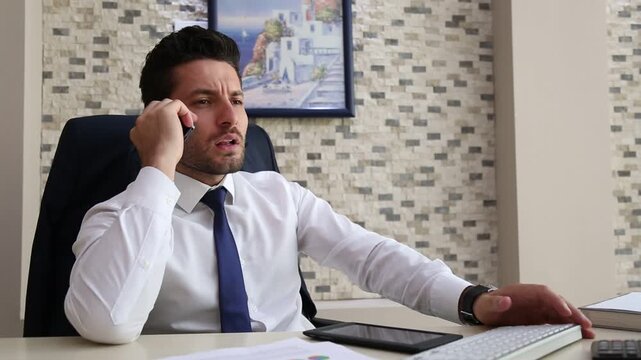 Worried Businessman Receiving Bad News on Phone