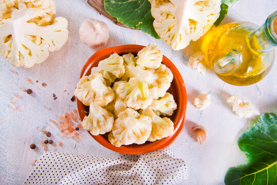 Head of cauliflower sits on a light table
