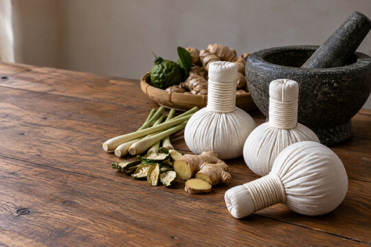 Thai herbal compress bundles with natural ingredients and copy space